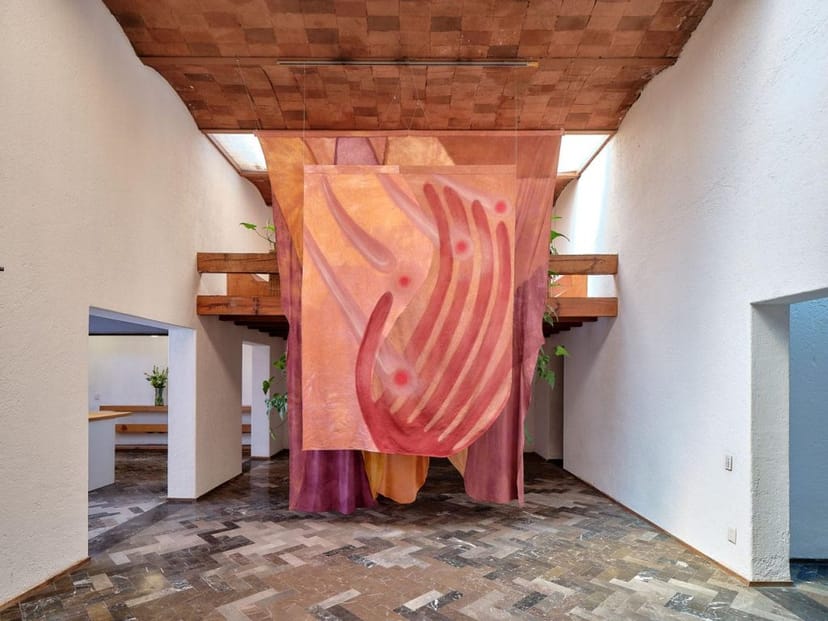 JO-HS art gallery event space with central textile installation for corporate and luxury events.
