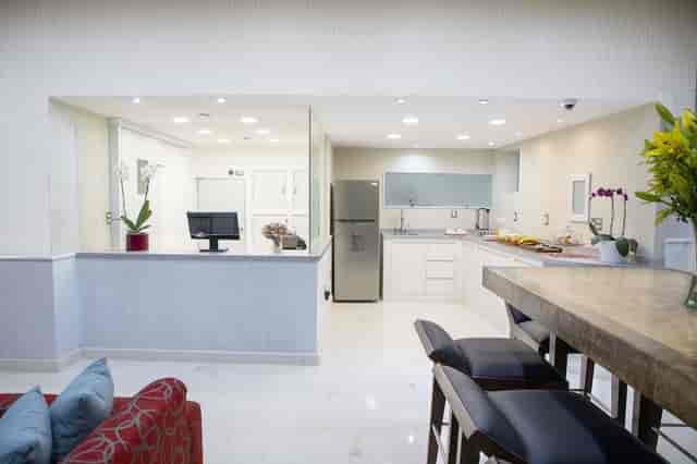 Hotel in Suites Coben: VIP breakout suite with catering pantry for event staging.