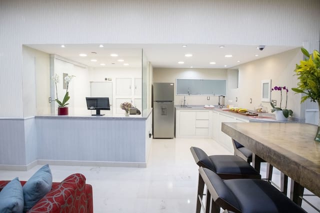 Hotel in Suites Coben: VIP breakout suite with catering pantry for event staging.