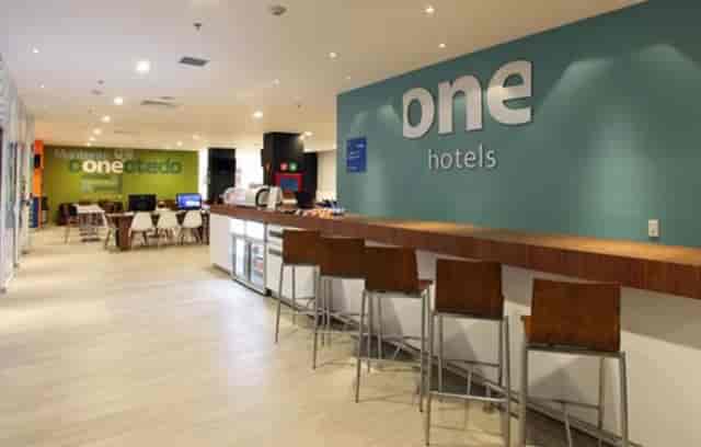 Modern hotel lobby with workspaces for conferences and business networking in Mexico City.