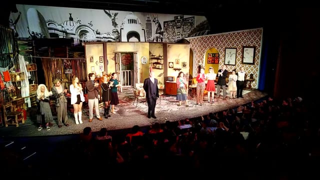 Hotel Royal Pedregal theater with live audience at a successful theatrical performance event.