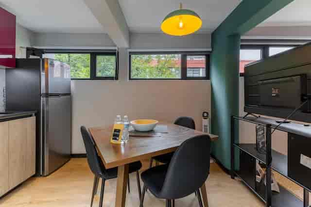 Cozy 1BR terrace nook for brainstorming and small-group corporate meeting event space.