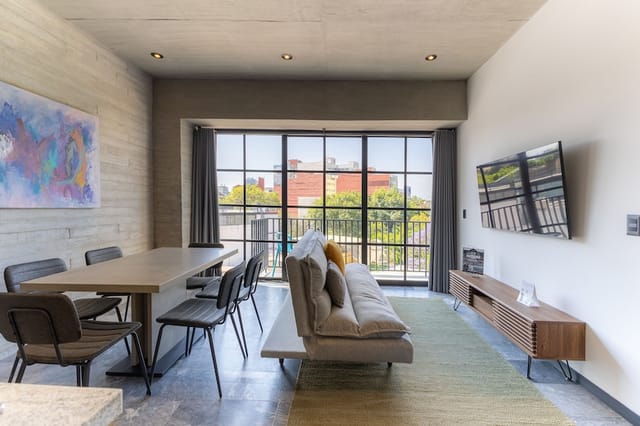 Cozy 1BR terrace nook: VIP green room or meeting space for corporate events and workshops.