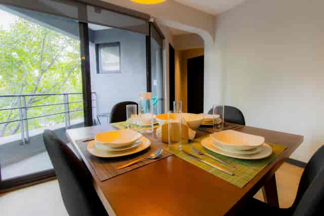 Dining area with skyline views in Capitalia Condesa Escandon for breakout meetings and events.