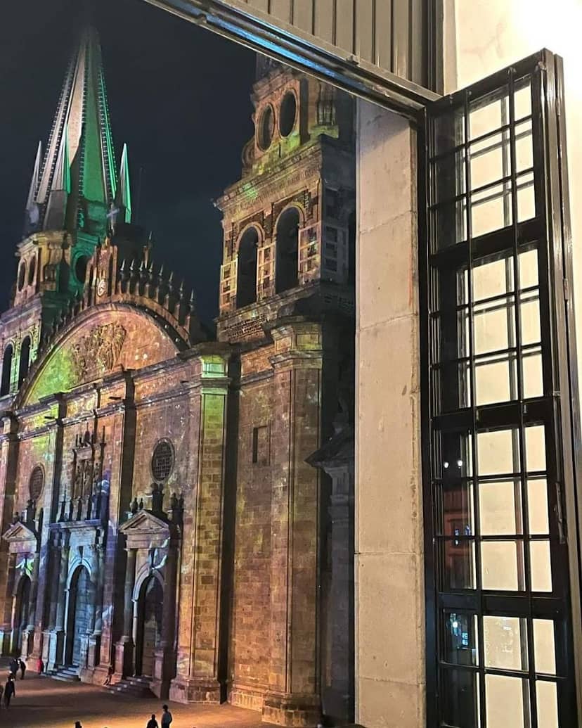 Architectural projection mapping on historic gallery facade for brand activation and evening event.