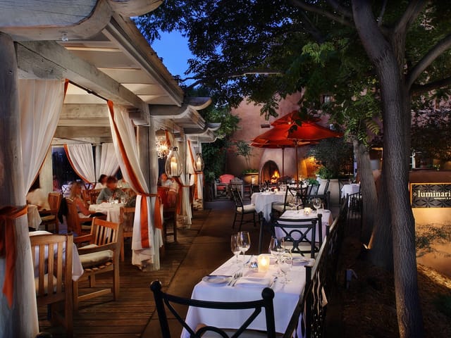 SkyFire Restaurant outdoor private dining room with ambient fireplace for upscale corporate events.