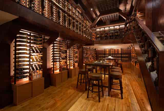 Upscale wine bar venue with floor-to-ceiling storage for executive tastings and networking events.