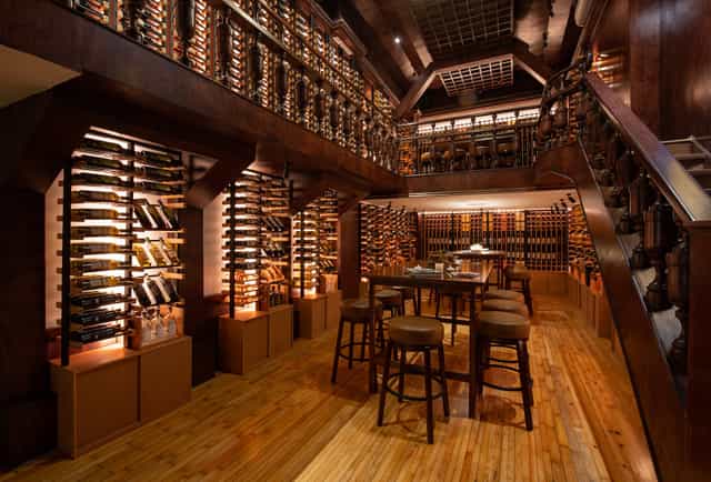 Upscale wine bar venue with floor-to-ceiling storage for executive tastings and networking events.