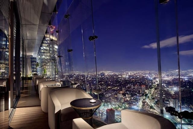 Modern hotel lounge with city views, ideal for VIP networking and cocktail events.