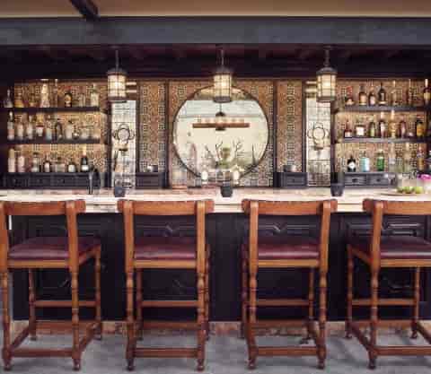 Tunki Rooftop bar with wooden stools for VIP reception or luxury networking event.