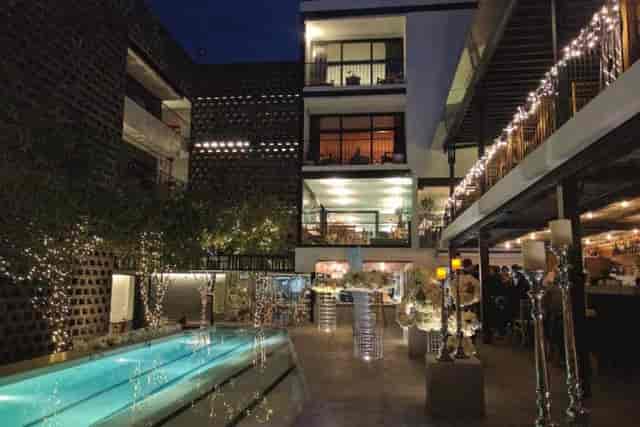 Alberca Bar at Hotel Carlota: intimate poolside boutique wedding reception venue with fairy lights.