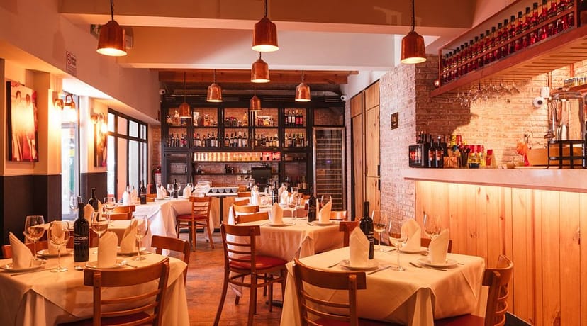 Turnkey restaurant for corporate dinners and networking events with warm, atmospheric aesthetic.