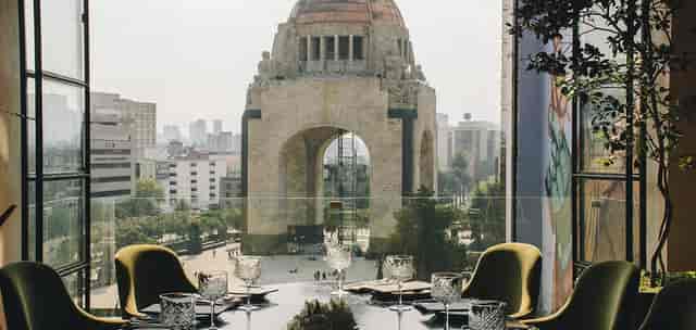 Legado Terraza restaurant venue with Monument to the Revolution backdrop for corporate events.