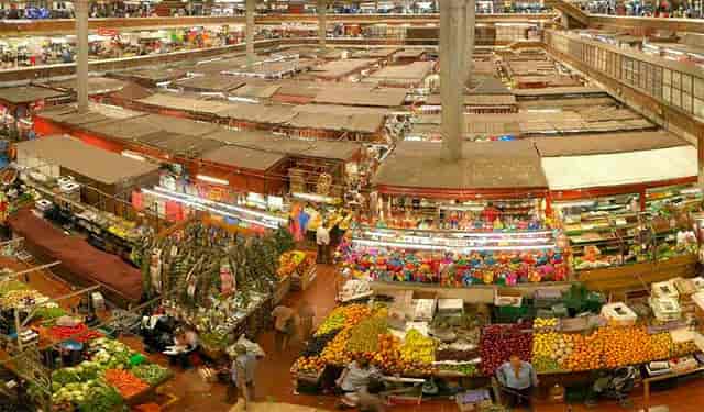 Mercado San Joaquin indoor market: crowded vendor stalls, ideal for street food festivals or pop-ups.