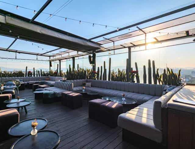 Rooftop lounge at La Caña with string lighting for high-end networking receptions and events.