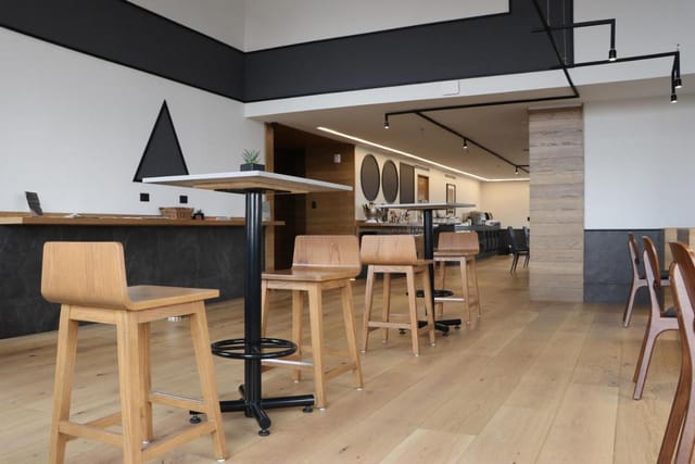Plaza Restaurant breakout space with bistro seating for corporate networking and hybrid events.