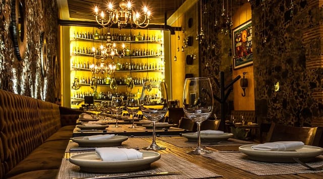 Limosneros Restaurante: sophisticated backlit bar for corporate dinners and VIP events.