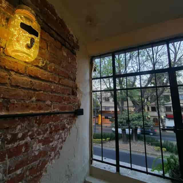 Industrial-chic breakout room with brick walls at El Hostalito Del Valle for corporate events.