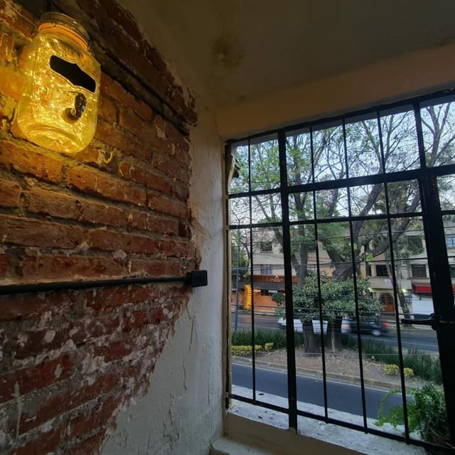 Industrial-chic breakout room with brick walls at El Hostalito Del Valle for corporate events.