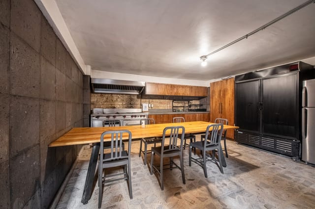 Industrial kitchen venue for team-building workshop and culinary events at Lucerna 32.