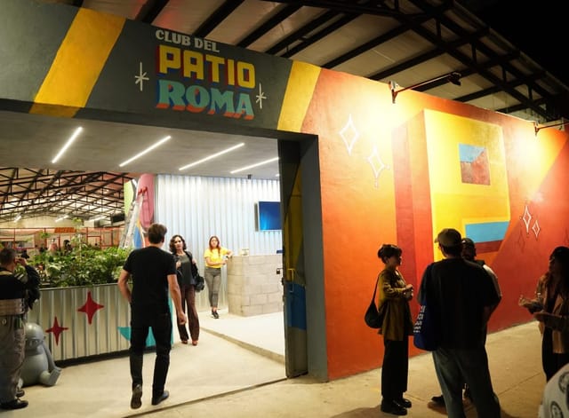 Industrial-chic patio venue with vibrant mural, perfect for corporate events and brand activations.