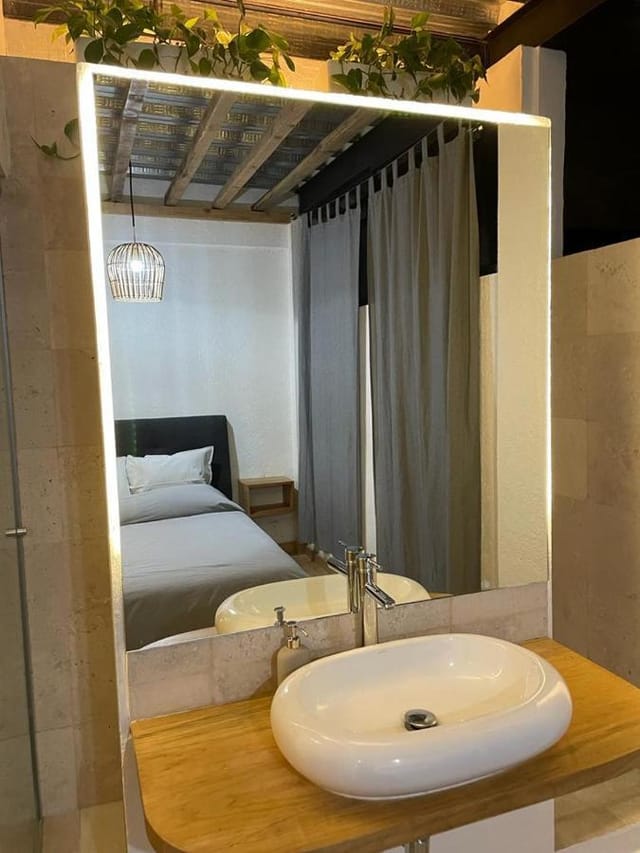 Minimalist hotel room in Coyoacan, Mexico City: boutique business accommodation.