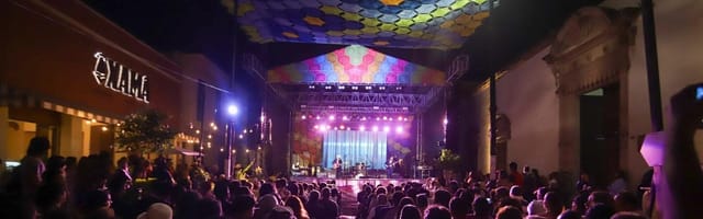 Centro Cultural Carranza outdoor stage with vibrant truss lighting for corporate event production.