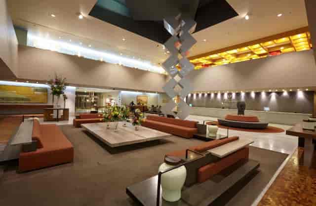 Mitla hotel lobby with high ceilings, ideal for corporate events and networking breakout spaces.