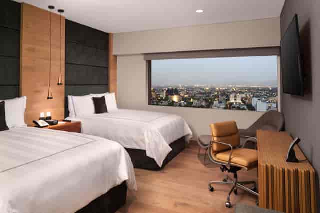Presidente InterContinental Mexico hotel room, business workspace for conference travel.