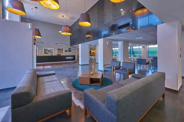 Modern hotel breakout room for business meetings and professional networking events.