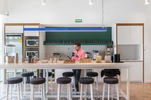 Modern Mitikah office pantry for corporate networking and business event rental space.