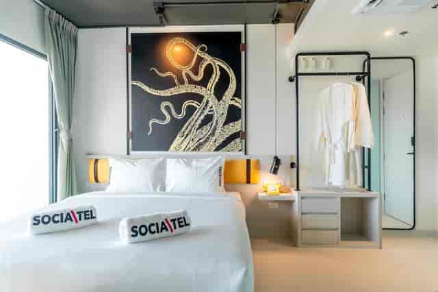 Minimalist Socialtel hotel room for corporate retreats and bleisure travel.