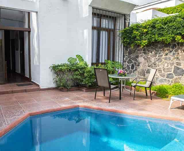 Private poolside meeting room at Hacienda Cocoyoc for VIP corporate off-site events.