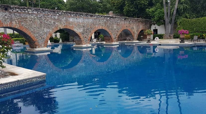 Luxury event venue at Hotel Hacienda Vista Hermosa featuring dramatic architecture and water.