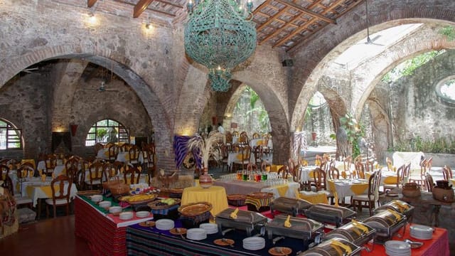 Rustic stone event venue with vaulted ceiling for destination weddings and corporate retreats.