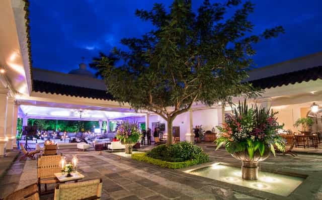 Covered Terrace at Las Mañanitas: Elegant courtyard venue for upscale evening reception events.