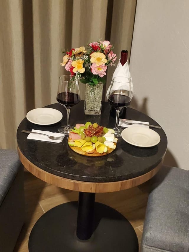VIP lobby lounge charcuterie and wine setup for corporate welcome events at Hotel Granada.