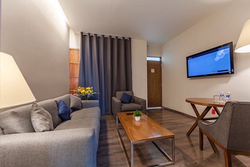 TV hall breakout room at Las Suites for small-group corporate strategy meetings.