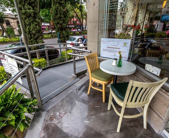 Stanza Hotel outdoor restaurant seating blocking ADA ramp, accessibility audit, safety inspection.