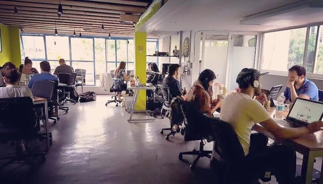 Modern coworking space with natural light for networking and productivity.