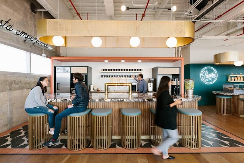 Modern networking lounge with bar seating for corporate conferences and business mixers.