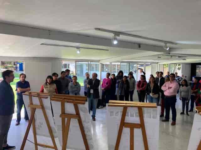 Informal gallery walk workshop at Casa de Las Bombas cultural center for collaborative events.