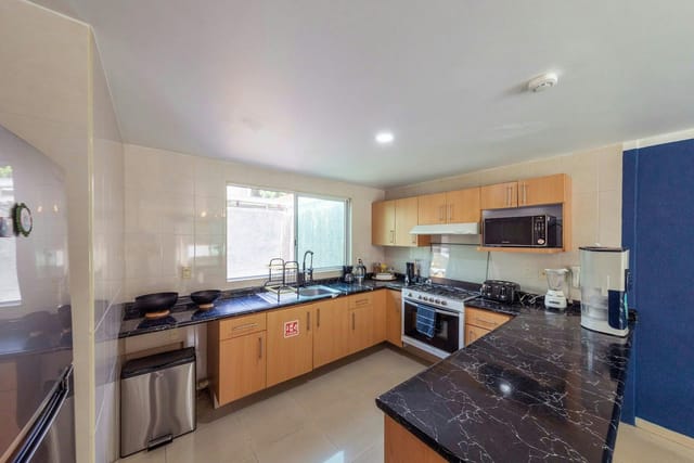 Standard double shared bathroom kitchen, ideal for corporate retreat catering and event staging.