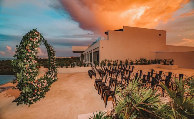 ATELIER Playa Mujeres sunset wedding ceremony on terrace, destination event venue.