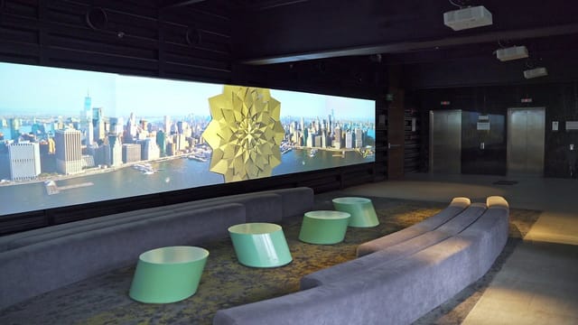 Fittipaldi breakout lounge with LED video wall for corporate events and brand activations.