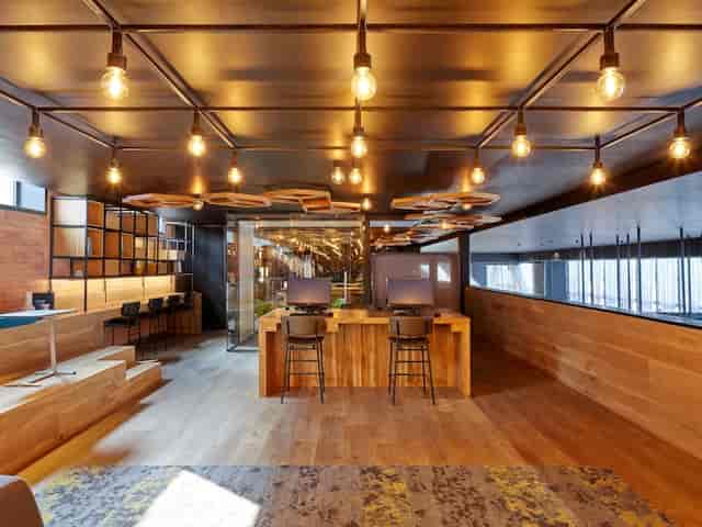 Gran Premio breakout space with tiered seating for modern coworking and corporate event venues.