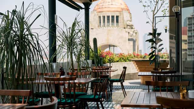 Rooftop terrace venue with architectural backdrop for VIP receptions and networking events.