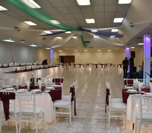 Banquet hall setup at Salón Princess, featuring classic ceiling draping for wedding events.