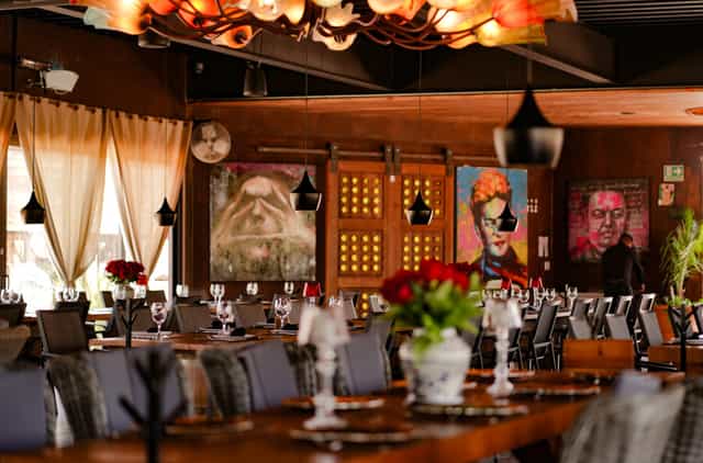 Sophisticated restaurant venue with dramatic lighting for corporate dinners and networking events.