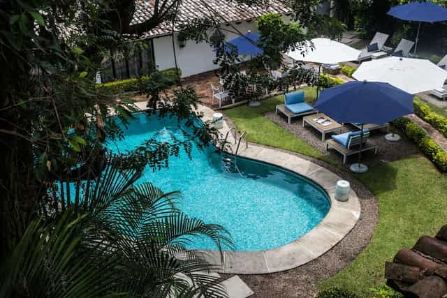Outdoor garden poolside retreat at Las Casas Boutique Hotel for corporate incentives and networking.